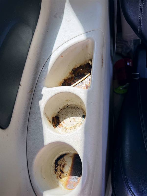 Before: dirty cup holders caked with grime