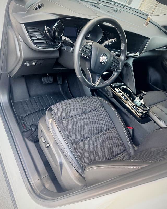 White Buick SUV front interior after detailing