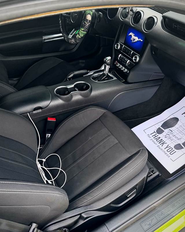 Mustang interior with clean seats and floor, paper mat in place