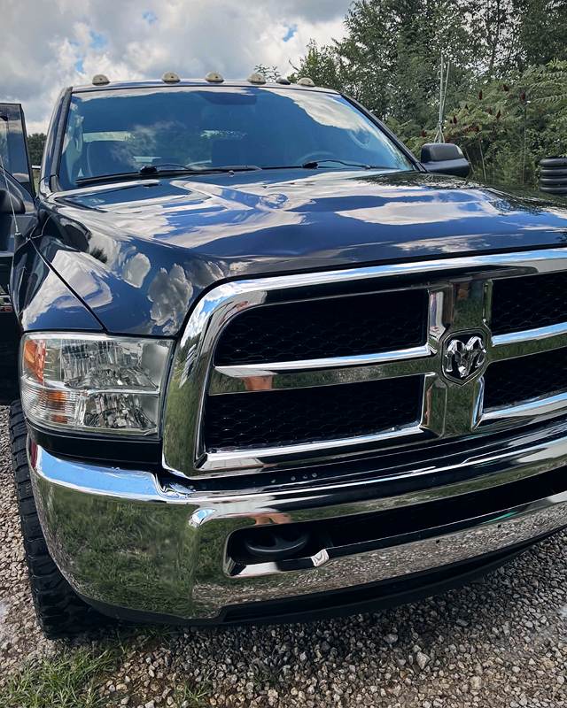 Ram grille and chrome bumper shining after a wash