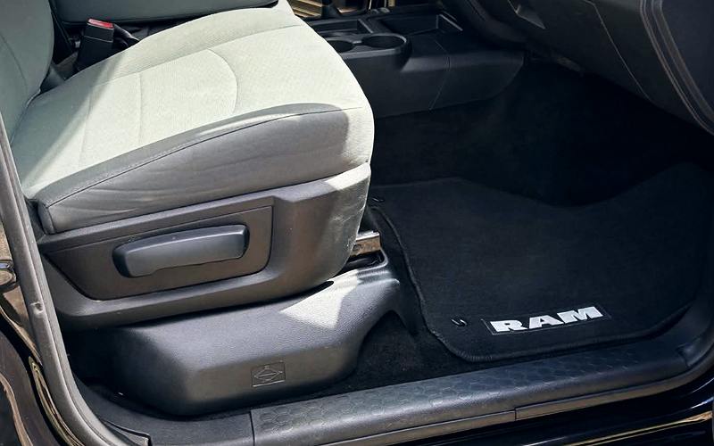 Freshly detailed Ram truck interior with clean cloth seats and floor mats